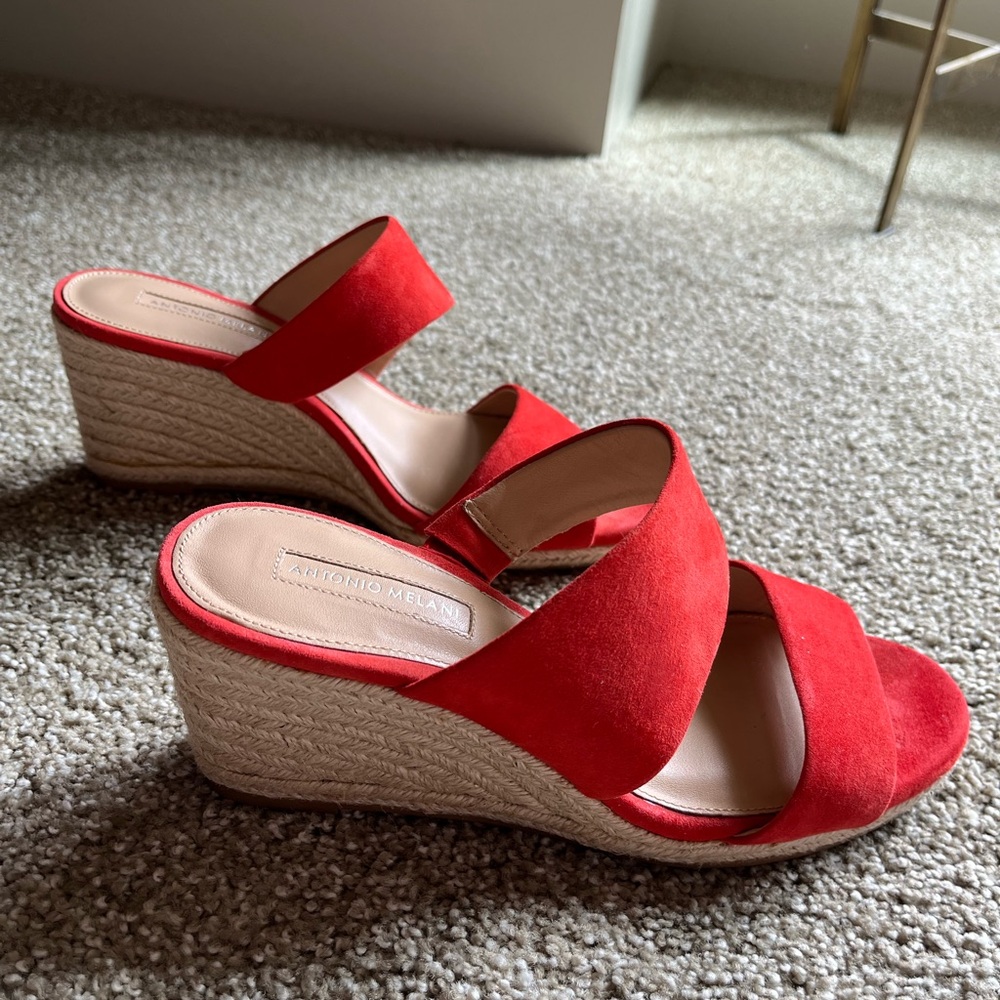 Orange swede two strap sandal with wedged heel.